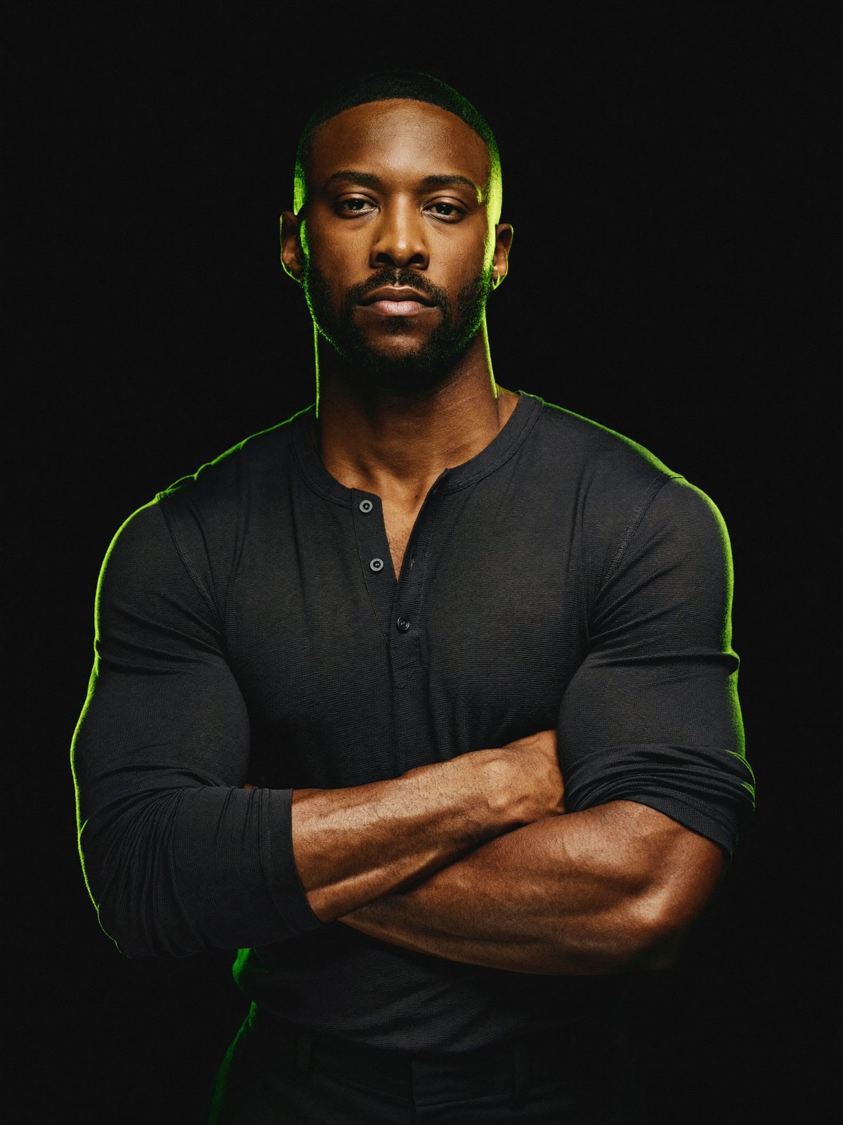 A confident, self-possessed man standing tall, calm and in control